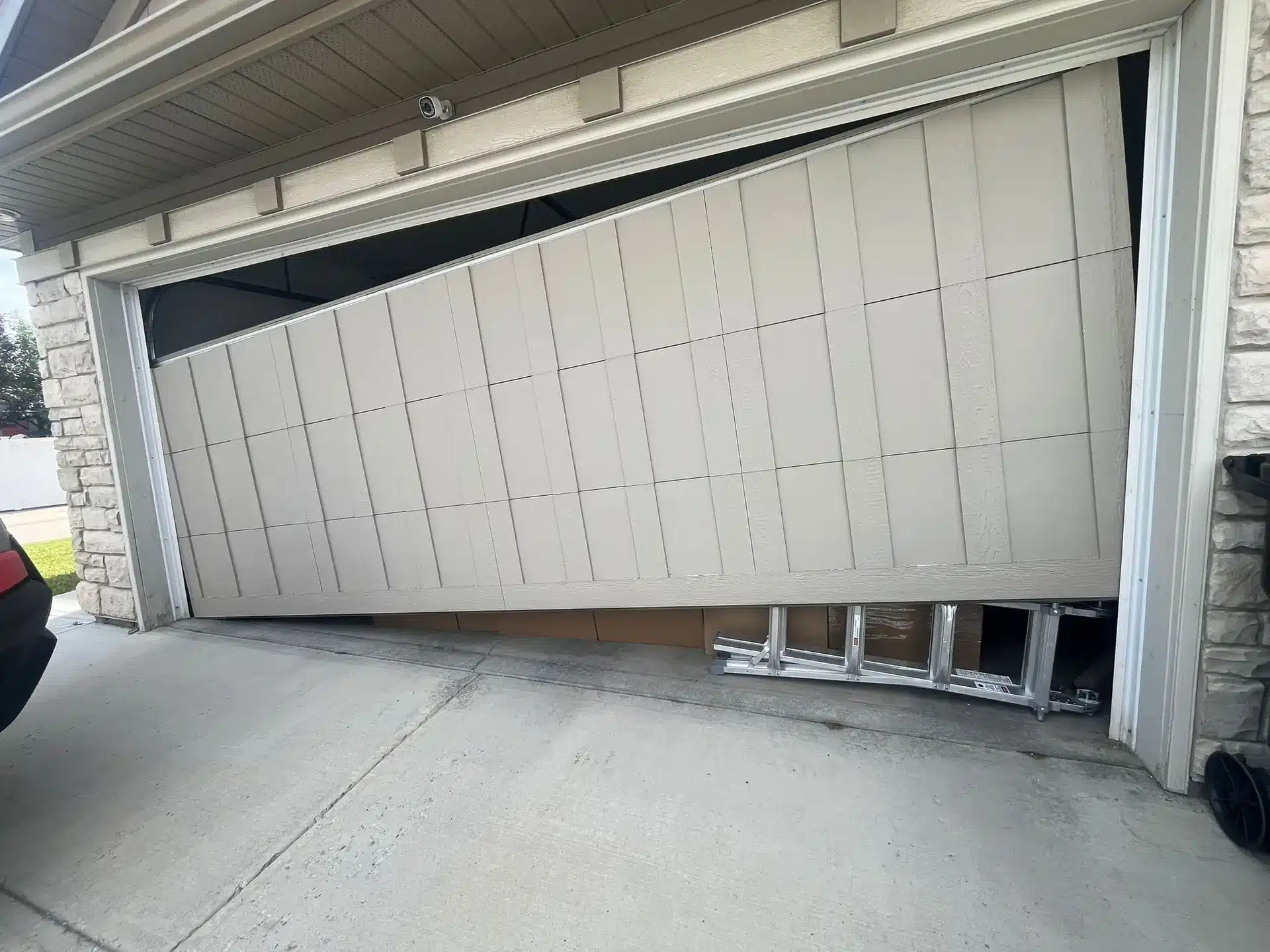 Broken garage door cable before repair — Calgary